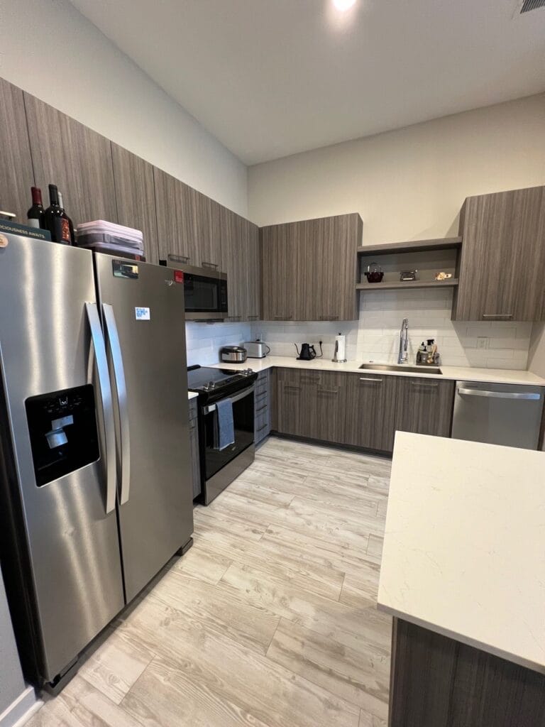 Reliable Cleaning Services in Morrisville, NC Modern Morrisville kitchen with stainless steel appliances and wood cabinets – professionally cleaned by Bright Oak Home Services