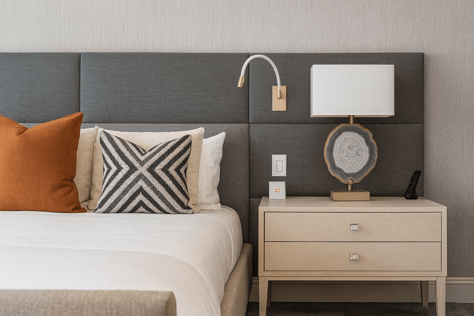 Reliable Cleaning Services in Morrisville, NC Modern, neatly made bedroom with stylish pillows and clean nightstand in Morrisville home cleaning by Bright Oak