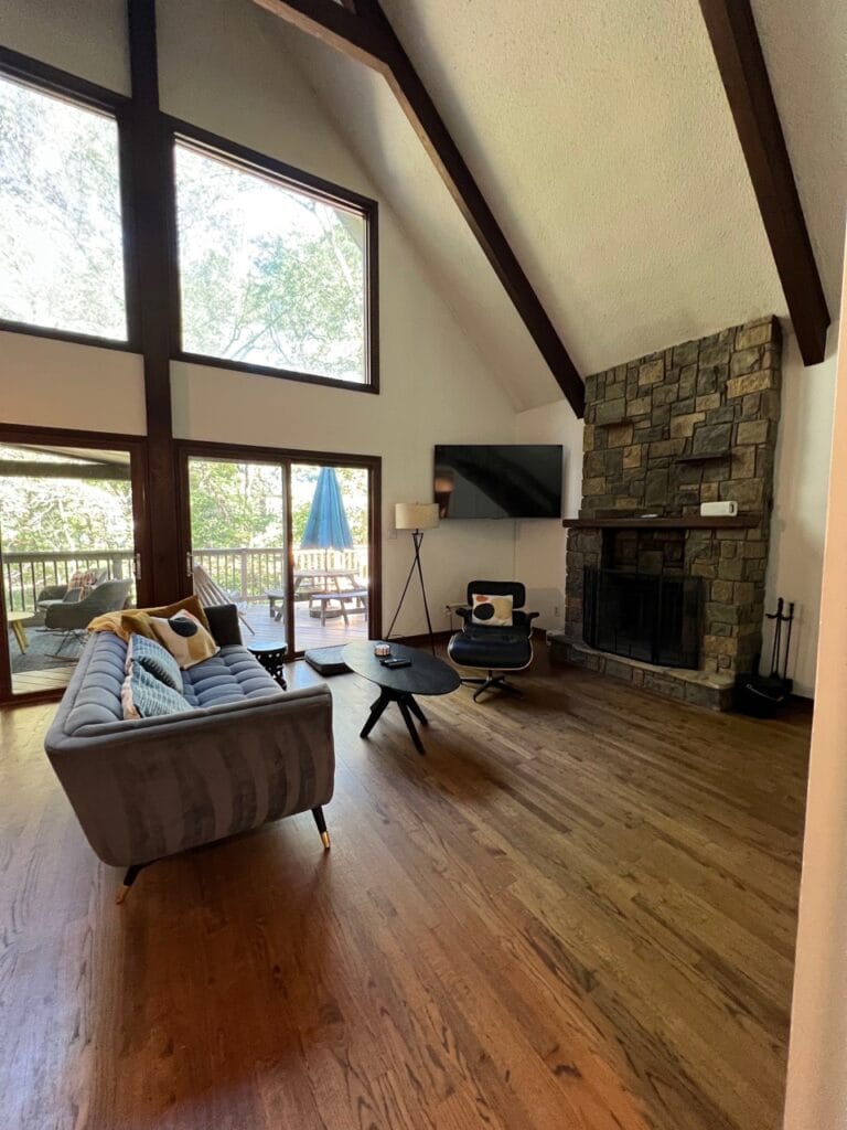 Reliable Cleaning Services in Morrisville, NC Spacious living room with vaulted ceiling, stone fireplace, and spotless hardwood floors – cleaned by Morrisville home cleaning professionals