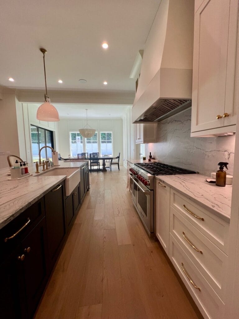 Reliable Cleaning Services in Morrisville, NC Bright, modern kitchen with marble countertops and wood flooring – spotless results from Morrisville home cleaning service